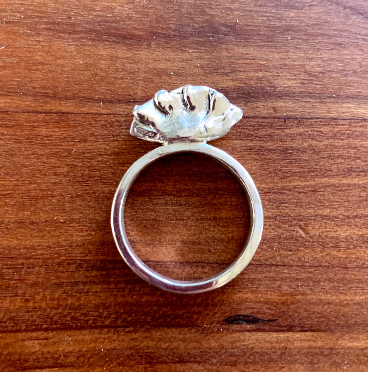 sterling silver dumpling ring on a butcher block background