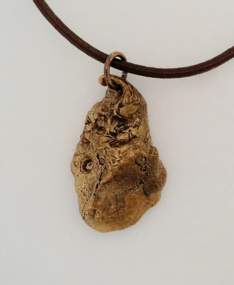 Bronze oyster shell necklace on leather cord 