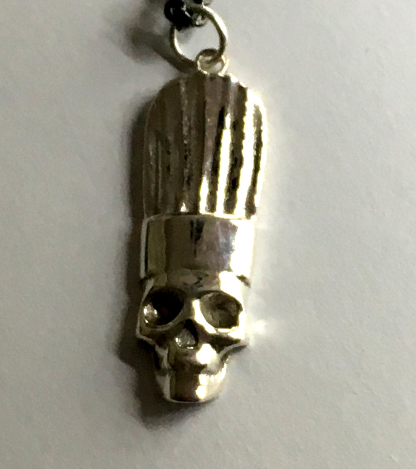 close up of chef skull pendant