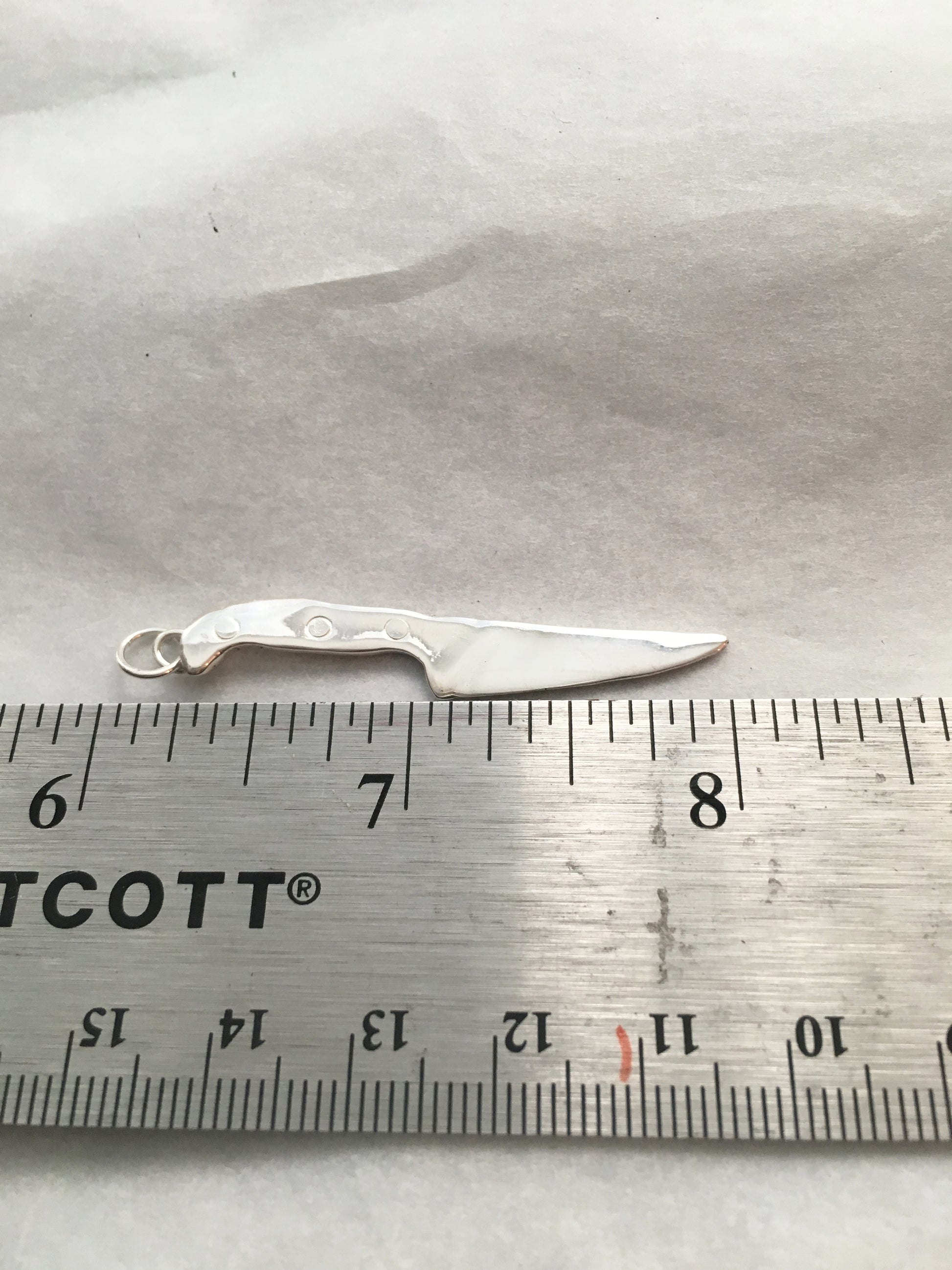 Jumbo chef knife charm measuring about 2 inches